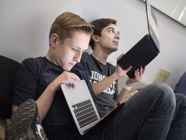 Sam Cottington, left, and Lucas Barros fill out an online questionnaire.