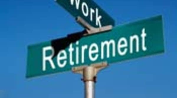 Work/retirement crossroads sign.