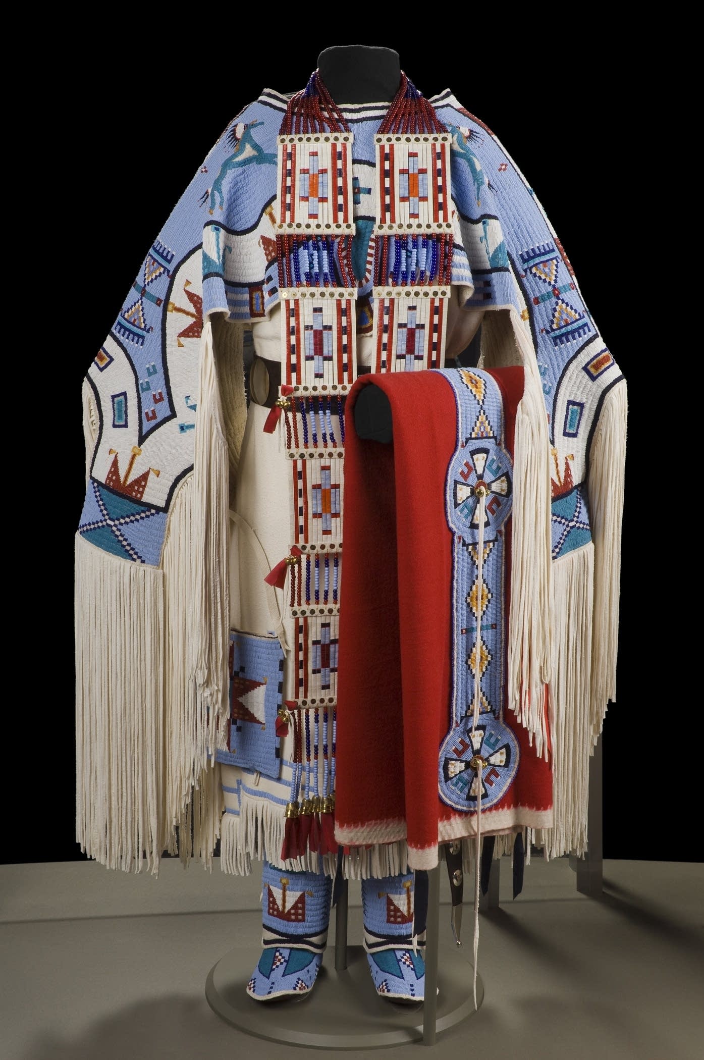 An intricately beaded Dakota dress and accessories