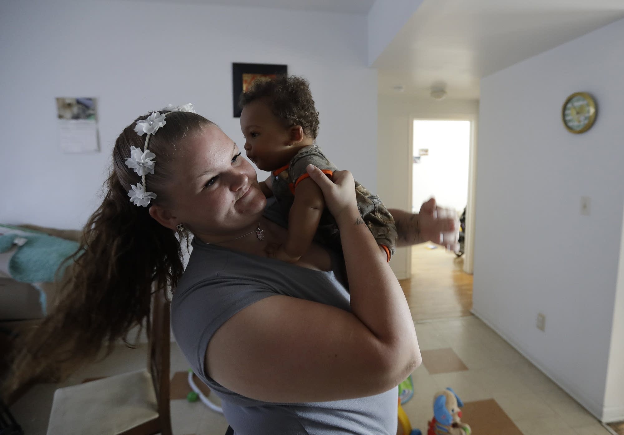 Shawnee Wilson holds her son, Kingston, in her apartment in Indianapolis.