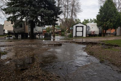 Water runs down from the campground during a flash flood