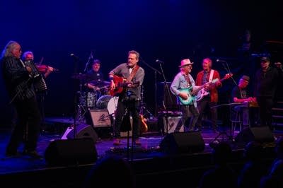 A large band performs on stage.