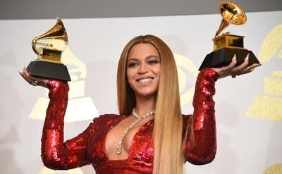 inger Beyonce poses with her Grammy trophies in the press room during the 59th Annual Grammy music Awards on February 12, 2017, in Los Angeles, California.