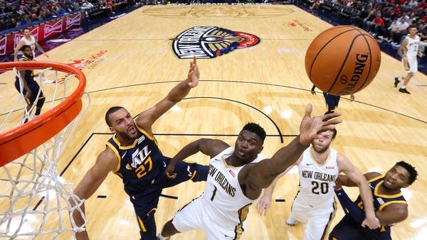 Zion Williamson #1 of the New Orleans Pelicans shoots against Rudy Gobert #27 of the Utah Jazz during the second half of a game at the Smoothie King Center on October 11, 2019 in New Orleans, Louisiana.