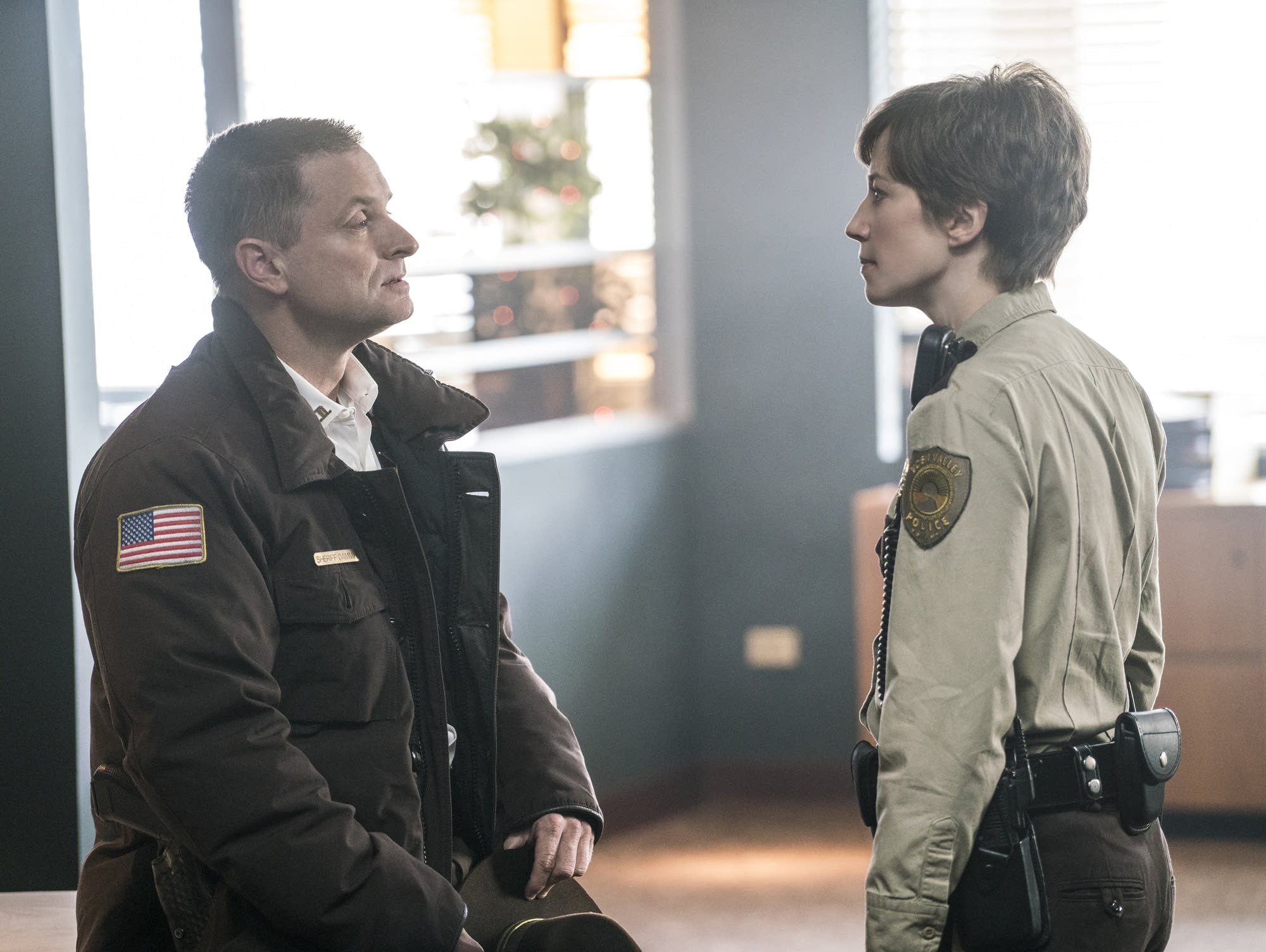 Sheriff Moe Dammik (Shea Whigham) lectures Gloria Burgle (Carrie Coon)