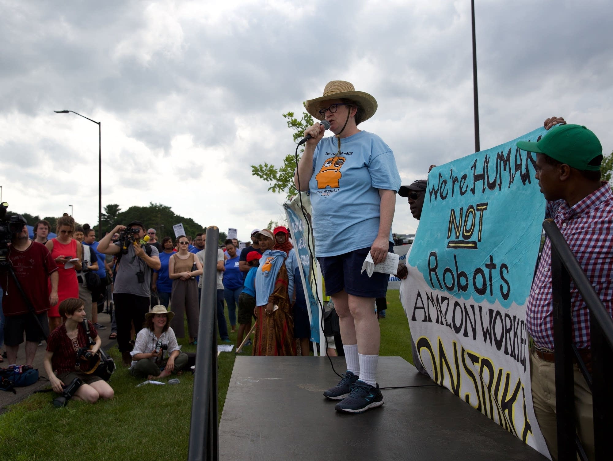 Amazon employee Meg Brady speaks at a rally outside the Amazon warehouse.
