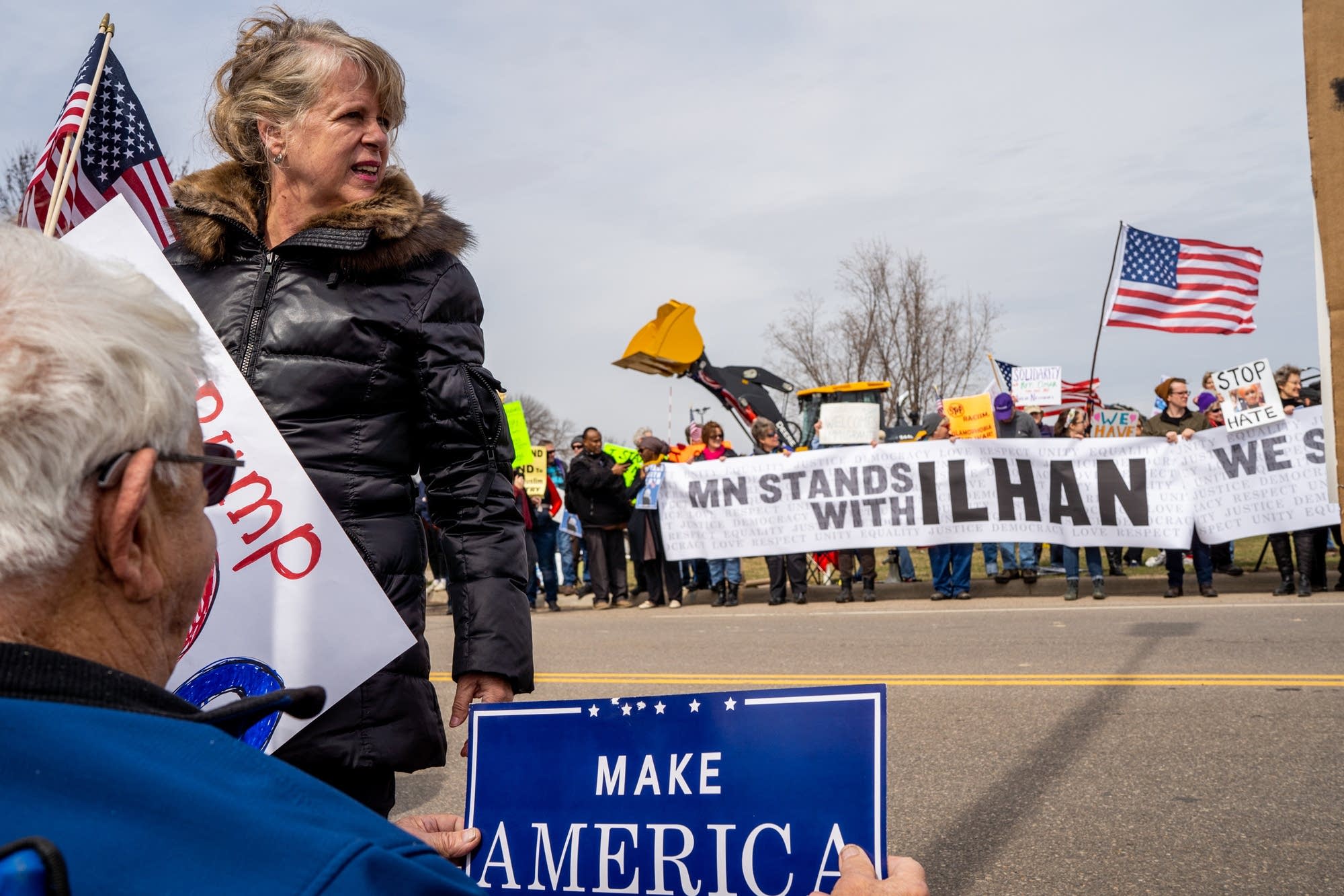 Supporters wait for the president to arrive in Burnsville, Minn.