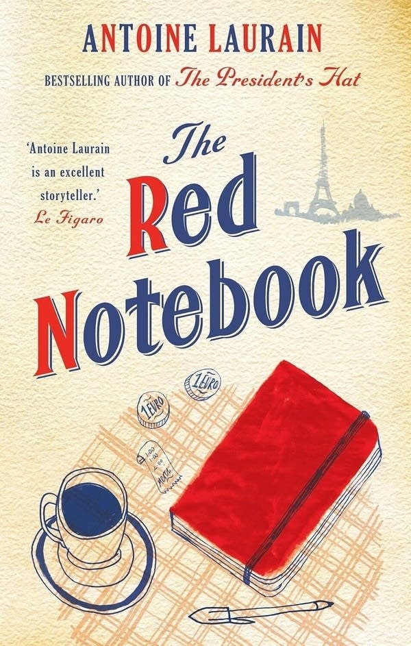 The cover of the book, "The Red Notebook," by Antoine Laurain. It's beige with a drawing of a red notebook sitting on a cafe table.