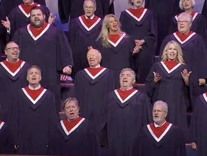 A 100-voice choir sings at a rally Sunday in Texas.