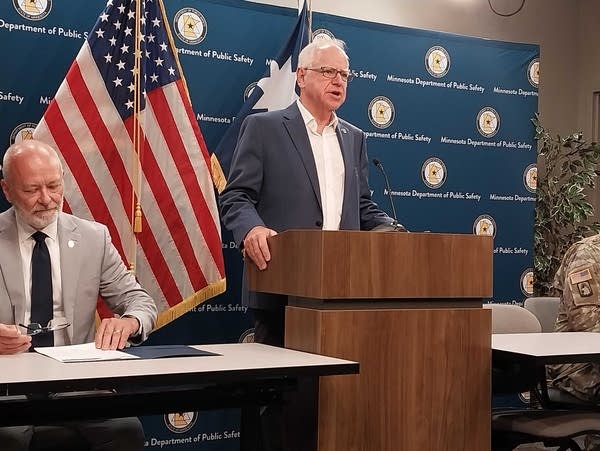 A man speaks at a podium