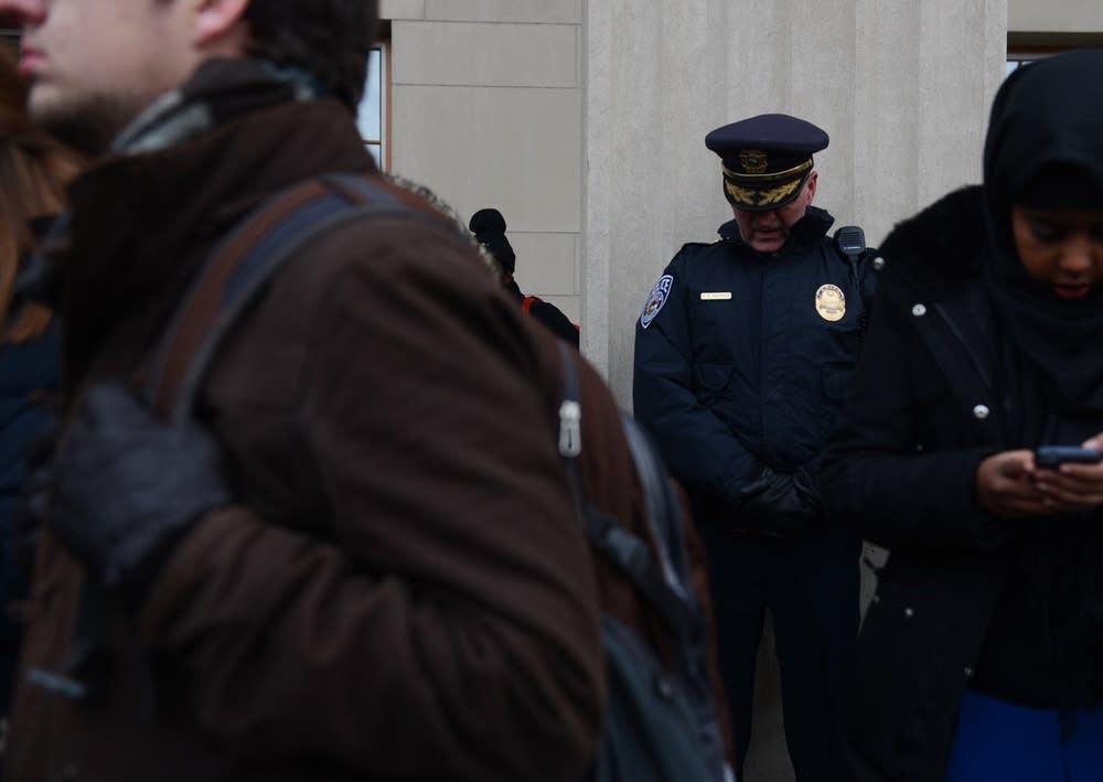 UMPD chief Greg Hestness bows his head