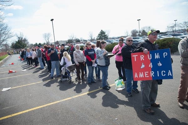 Trump supporters wait in line.