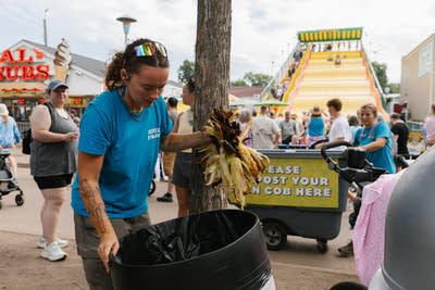 A person sorts through trash