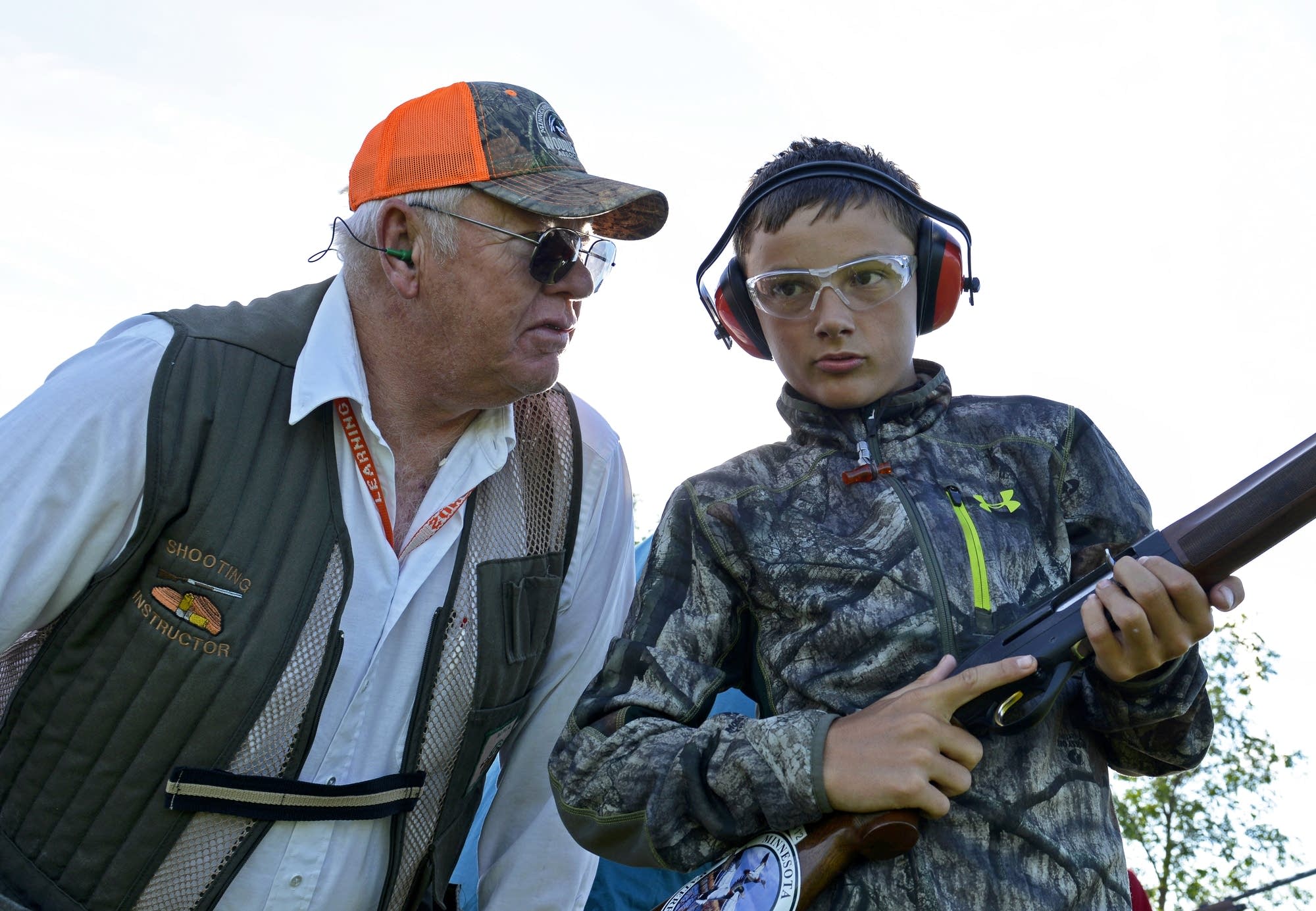 Instructor Steve Pagel (left) coaches Joey Heiser on the shooting range.