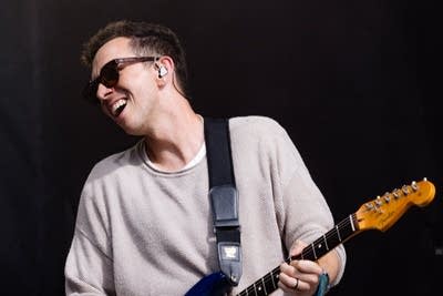 cory wong playing guitar on stage