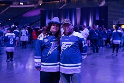 Two people pose for a photo