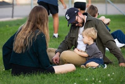 Family sitting on the grass