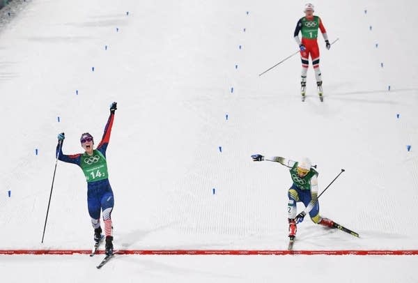 Three cross country skiers are