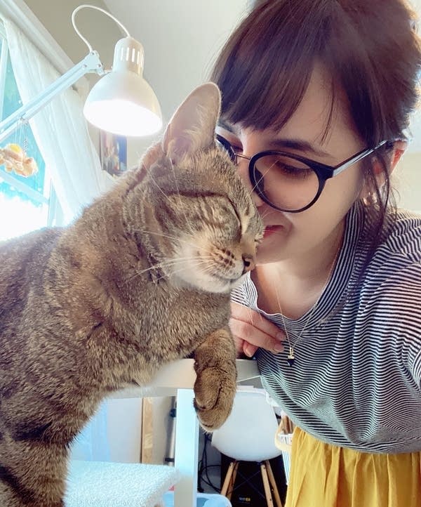 Illustrator Heidi Moreno with her cat, Peanut.