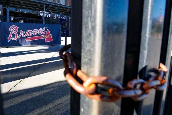 ATLANTA, GA - SEPTEMBER 30: Gates are locked outside of Truist Park prior to Game One of the National League Wild Card Series between the Cincinnati Reds and Atlanta Braves at Truist Park on September 30, 2020 in Atlanta, Georgia.