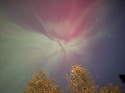 Red and green lights cover the night sky.
