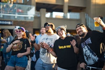 Group of people singing and smiling