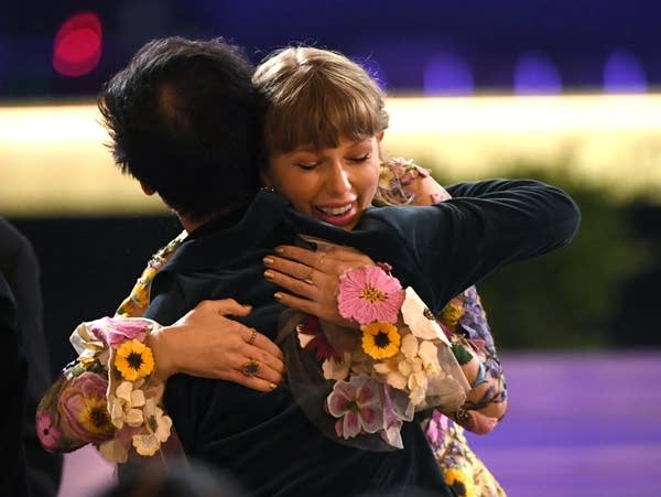 Taylor Swift celebrates her Grammy win for Album of the Year, 'Folklore.'