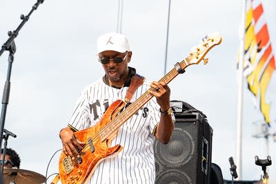 A band performing on an outdoor stage