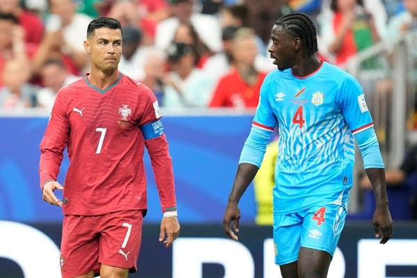 Portugal and Congo players react during World Cup