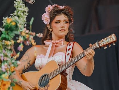 sierra ferrell and her band performing on an outdoor stage