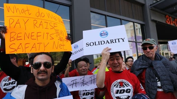 Uber and other app-based drivers protest falling wages and lack of job security outside the New York City Uber and Lyft headquarters on May 8. 