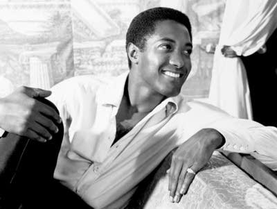 Sam Cooke seated on couch