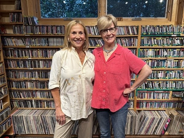 two women pose for picture