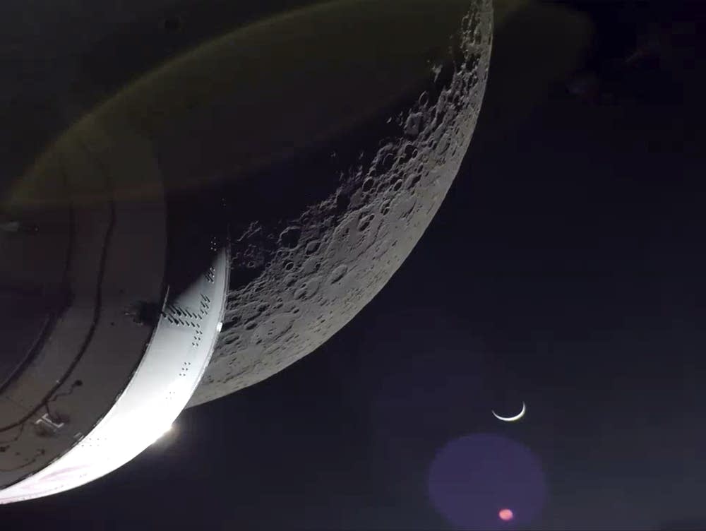NASA's Orion capsule blazes home from test flight to moon | MPR News