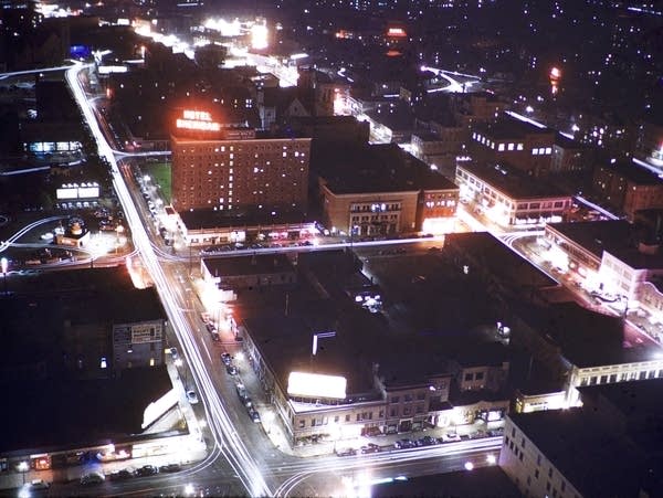 A time-exposure photo of traffic on streets in downtown Minneapolis