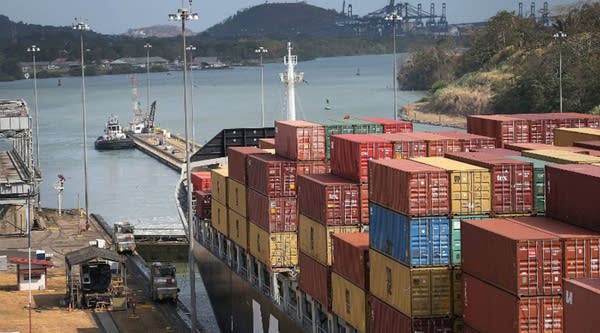 A cargo ship makes its way through the Miraflores locks as it crosses the Panama Canal on April 7, 2016 in Panama City.