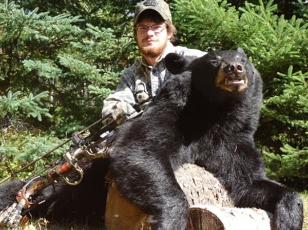 Brandon Greeley poses with bear