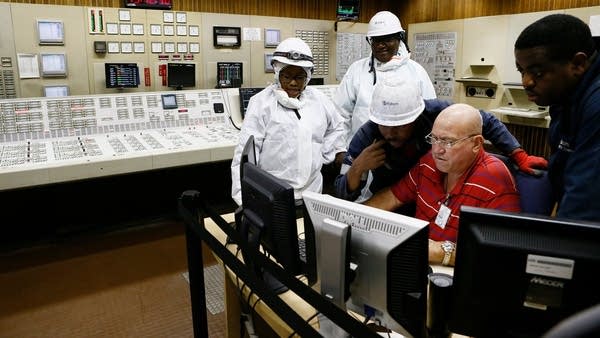Workers are seen inside the Section 3 control center at Lethabo Power Station on April 3, 2019 in Sasolburg. 