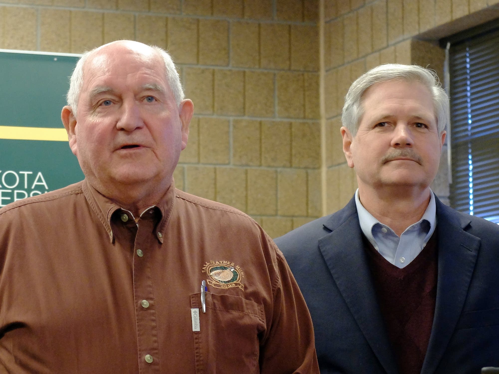 U.S. Agriculture Secretary Sonny Perdue, left, speaks with reporters.