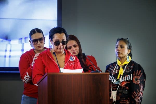 Natosha White speaking at a podium