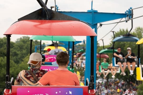 people riding skyglider 