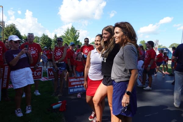 Lisa Demuth, left, and Michele Tafoya, right, pose with a supporter