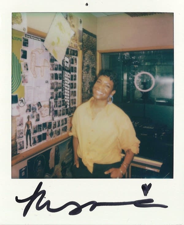 a signed polaroid with a woman in it