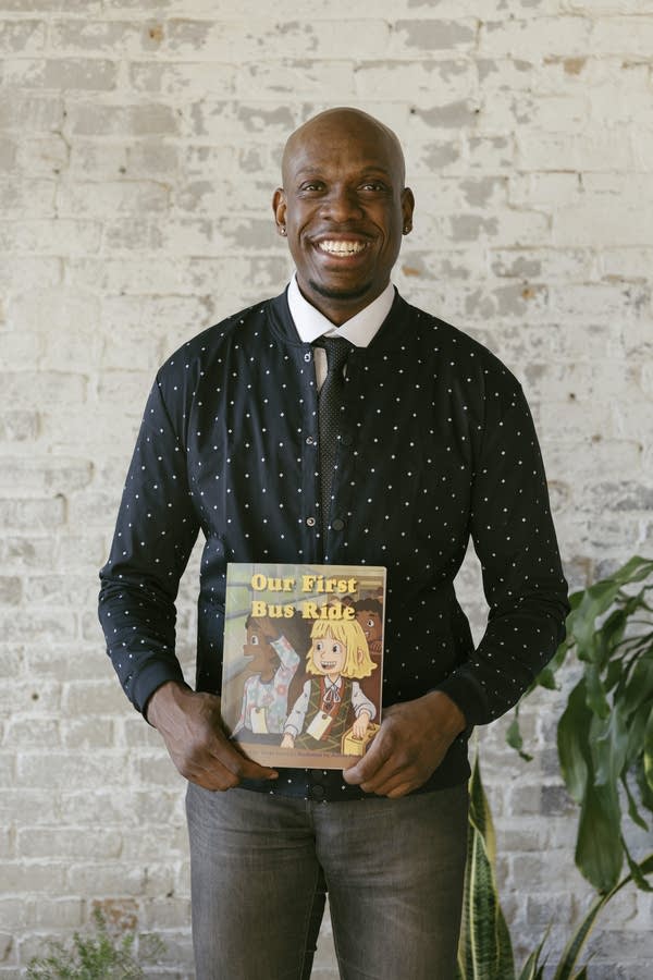 Derek Francis with his children's book