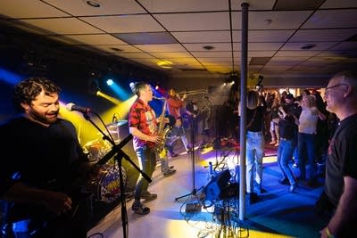 Band performing and crowd dancing