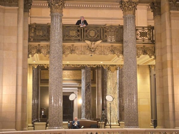 A man looks over the rotunda at the Capitol