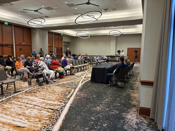 Council members speaking at a community listening session