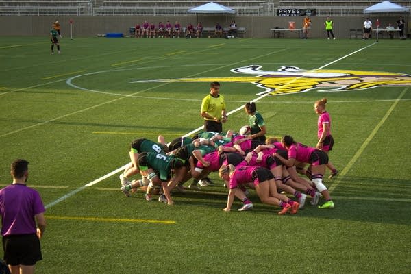 People play a game of rugby