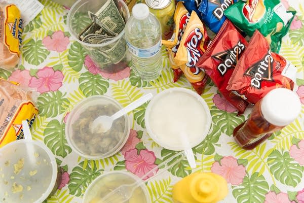 Stock items sit scattered around the counter.