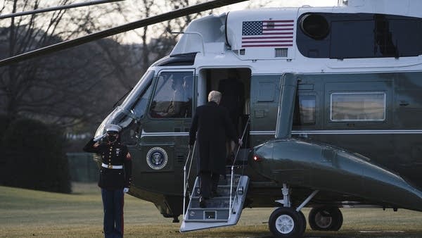 President Donald Trump and first lady Melania Trump board Marine One as they depart the White House on Jan. 20, 2021 in Washington.